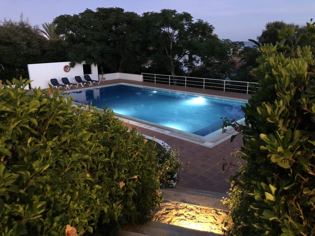 Heated private pool at night at La Calera villa in Binibeca Menorca